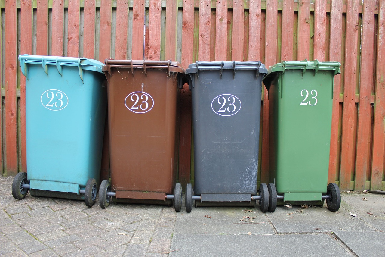 4 different coloured bins, with the number 23 on the side.