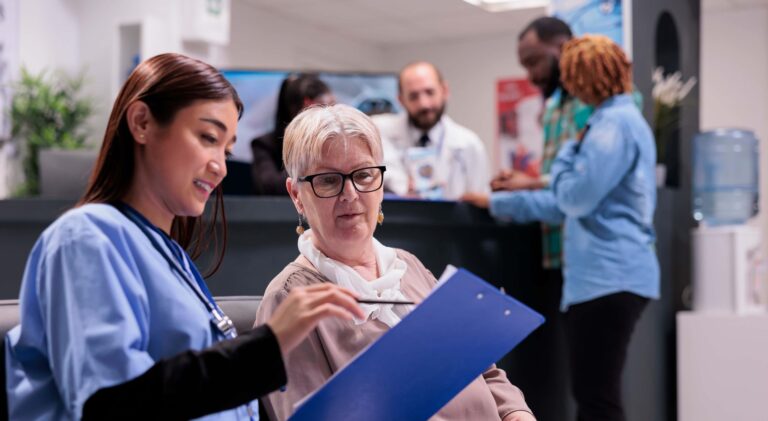 NHS Nurse explaining protocols to patient in UK